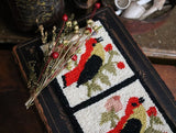 Old American History Book and Hooked Rug Depicting Birds