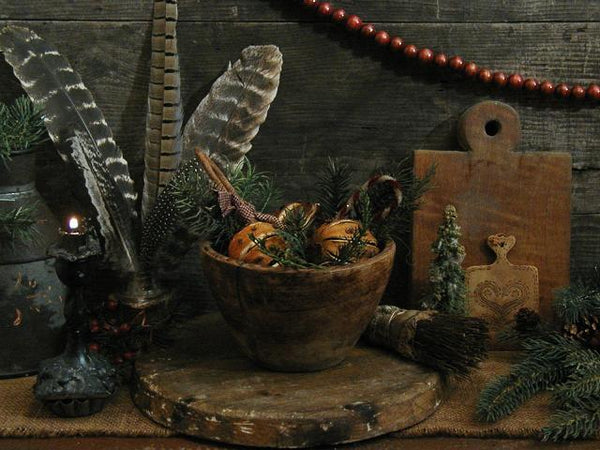 Primitive old Wooden Bowl with Cloved Oranges and Christmas Greens