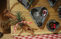 Antique Heart Cookie Cutters on Decorative Wooden Board