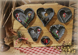 Antique Heart Cookie Cutters on Decorative Wooden Board
