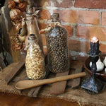 Primitive Riser with Three Old Glass Bottles and Wooden Spoon Gathering