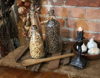 Primitive Riser with Three Old Glass Bottles and Wooden Spoon Gathering